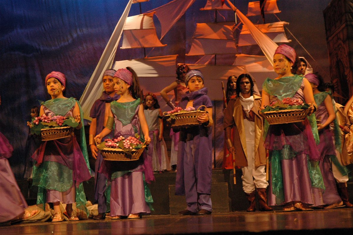 A cast in Andean-inspired costumes