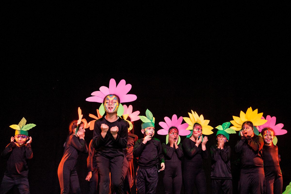 A children’s choir dressed as flowers and sunflowers