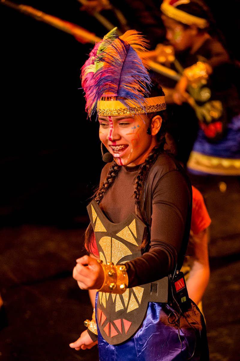 A boy with a colourful headdress