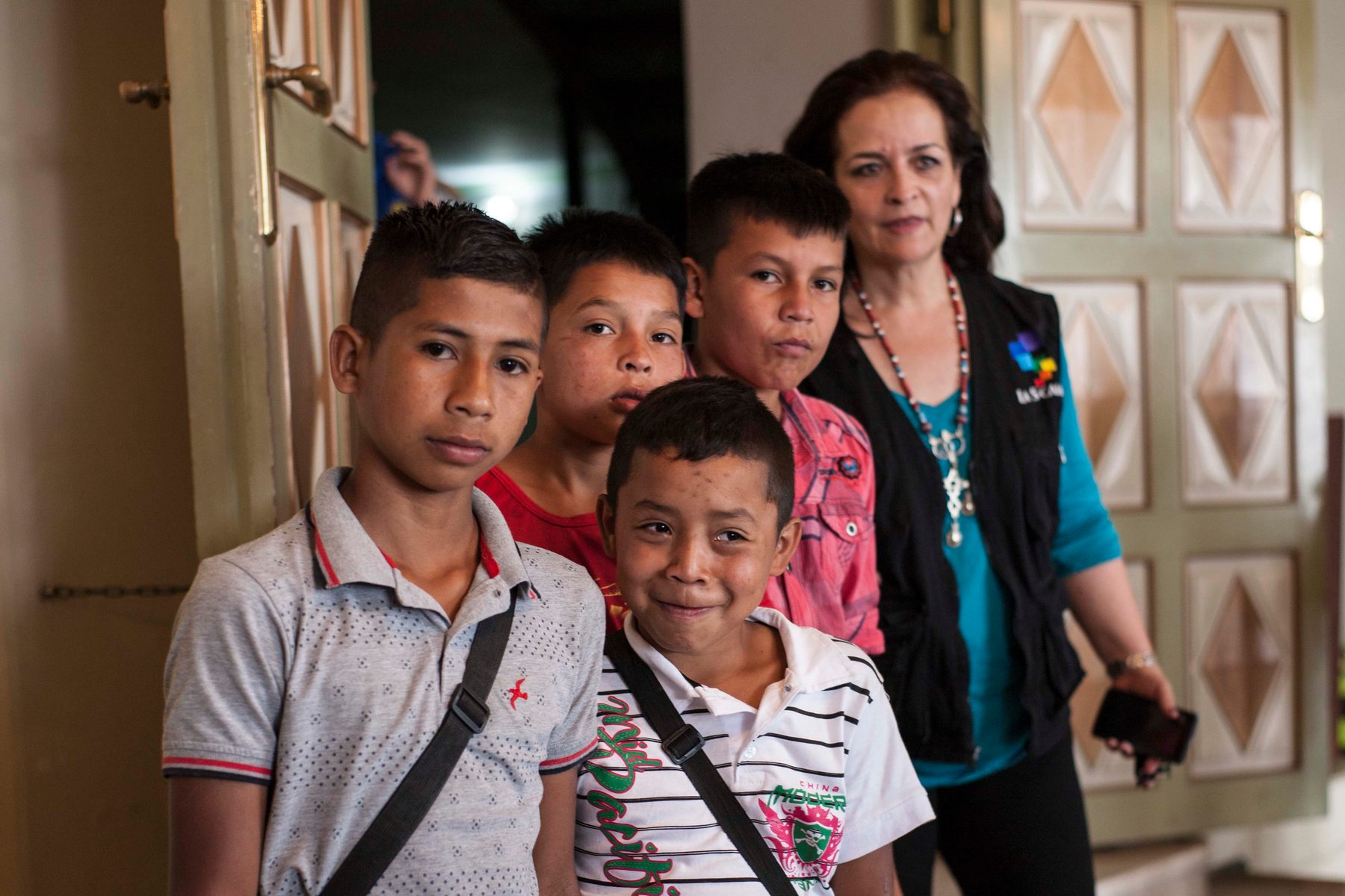 Rosana with a group of children wearing foundation vests